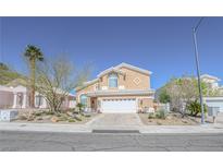 Charming two-story home with manicured landscaping and inviting curb appeal at 8120 Neptune Beach Ave, Las Vegas, NV 89128