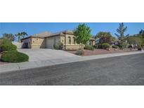 Charming single-story home featuring a spacious driveway, desert landscaping, and a two-car garage at 8370 Unicorn St, Las Vegas, NV 89131