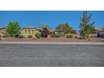 Beautiful single-story home with desert landscaping and a tile roof under a clear blue sky at 8370 Unicorn St, Las Vegas, NV 89131