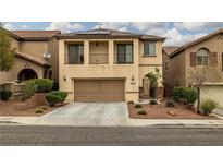 Inviting two-story home featuring a two-car garage and a charming front yard with landscaped details at 10766 La Florentina Ave, Las Vegas, NV 89166