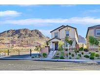 Charming two-story home showcasing desert landscaping, and picturesque mountain views at 1388 Graphite Ave, Henderson, NV 89002