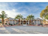 Charming ranch-style home with desert landscaping and inviting covered porch at 2125 Mateuse St, Logandale, NV 89021