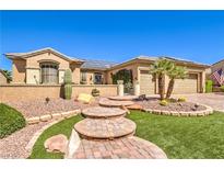 Charming single-story home boasting lush desert landscaping, walkway and attached two-car garage at 2776 White Sage Dr, Henderson, NV 89052