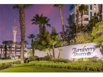 Gorgeous exterior view of Turnberry Towers, with palm trees and a view of the city at 322 Karen Ave # 506, Las Vegas, NV 89109