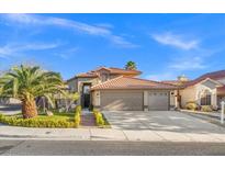 Charming single-Gathering home featuring a well-maintained yard, desert landscaping, and a spacious three-car garage at 5628 Crimson Ridge Dr, Las Vegas, NV 89130