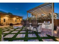 This outdoor kitchen has a built in grill and is perfect for outdoor entertaining at 2664 Ornate Regiment St, Henderson, NV 89044