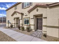 Inviting townhouse exterior with a covered entryway and low-maintenance landscaping at 7890 Pandora Sky St # 252, Las Vegas, NV 89084