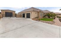 Beautiful single story home with a large concrete driveway and an attached two car garage at 8369 Eagle Estates Ct, Las Vegas, NV 89131