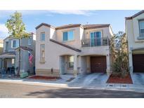 Charming two-story home featuring an attached garage and small balcony at 9105 Captivating Ave, Las Vegas, NV 89149