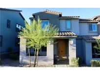 Stylish two-story home showcasing a modern facade, desert landscaping, and a welcoming entryway at 11561 Cedar Shore Ave, Las Vegas, NV 89138