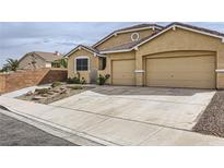 Beautiful single-story home featuring a spacious driveway and a two-car garage at 306 Saint Augustine Ln, Henderson, NV 89014