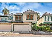 Charming two-story home featuring a two-car garage and lush landscaping at 4043 Chalfont Ct, Las Vegas, NV 89121