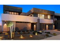 Modern two-story home featuring a landscaped front yard, desert foliage and a two car garage at 1172 Monte De Luz Way, Henderson, NV 89012