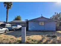 Modest single story home with front yard, covered vehicle, and mature landscaping at 5809 Pebble Beach Blvd, Las Vegas, NV 89108