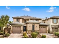 Charming two-story home featuring a three car garage, and desert landscaping at 8216 Swallow Falls St, North Las Vegas, NV 89085
