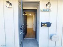 Welcoming front entrance featuring updated lighting and contemporary door hardware at 859 Center St, Henderson, NV 89015