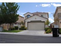 Charming two-story home featuring a well-manicured front yard and an attached two-car garage at 11039 Pegasus Dr, Las Vegas, NV 89135
