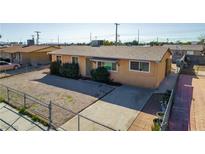 Charming single-story home with a low-maintenance gravel yard and a concrete driveway at 1805 Helen Ave, North Las Vegas, NV 89032