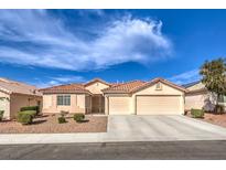 Charming single-story home featuring a well-maintained front yard and a spacious two-car garage at 6217 Statue St, North Las Vegas, NV 89081
