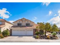 Charming two-story home with a two-car garage and well-maintained landscaping at 10024 Skipper Ct, Las Vegas, NV 89117