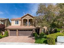 Charming two-story home showcasing a three-car garage, stone accents, and a well-manicured front yard at 1314 Cornet St, Henderson, NV 89052