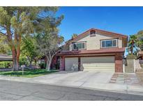 Charming two-story home featuring a well-manicured lawn and a spacious three-car garage at 1853 Heydon Ct, Henderson, NV 89014