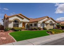 Inviting single story home with lush green artificial lawn and desert landscaping at 2212 Sierra Heights Dr, Las Vegas, NV 89134