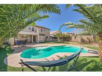 Inviting backyard pool with a hammock and a patio area perfect for outdoor relaxation and entertainment at 8228 Fritzen Ave, Las Vegas, NV 89131