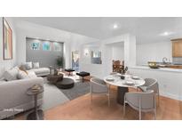Bright, airy living room featuring modern decor, hardwood floors, and neutral color palette perfect for entertaining at 10955 Sospel Pl, Las Vegas, NV 89141