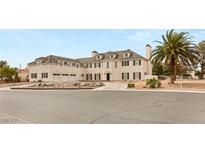 Elegant multi-story home with classic architectural design, three car garage, and meticulously landscaped front yard at 3207 Bel Air Dr, Las Vegas, NV 89109