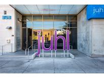 Modern building entrance featuring glass doors and the building name in large lettering at 353 E Bonneville Ave # 289, Las Vegas, NV 89101