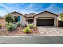 Charming single-story home with well-manicured front yard and a two-car garage at 6929 Benson Ferry St, Las Vegas, NV 89149