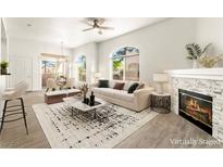 Bright living room boasts a fireplace, modern decor, and plenty of natural light at 700 Carnegie St # 3214, Henderson, NV 89052