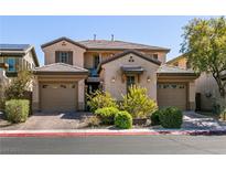 Beautiful two-story home with well-manicured landscaping and a two-car garage at 8224 Opal Falls St, North Las Vegas, NV 89085