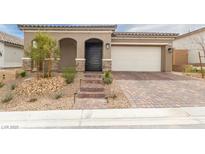 Charming single-story home with a brick driveway and well-maintained desert landscaping at 10943 Doresta Ave, Las Vegas, NV 89166
