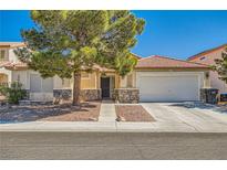 Charming single story home featuring desert landscaping and a two car garage at 1708 Gentle Brook Ave, Las Vegas, NV 89084