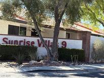 Exterior of Sunrise Village community sign with lush landscaping, mature trees, and well-maintained property at 2569 Malabar Ave, Las Vegas, NV 89121