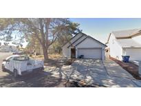 Charming single-story home featuring a two-car garage and low maintenance front yard at 363 El Pico Dr, Henderson, NV 89014