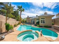 Inviting backyard pool and spa, perfect for relaxation and entertaining in a private outdoor space at 4574 Sheri Lyn Ct, Las Vegas, NV 89121