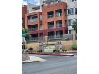 A lovely view of the condo building from street level highlighting Park Avenue Condominiums entrance and upper-level balconies at 51 E Agate Ave # 507, Las Vegas, NV 89123