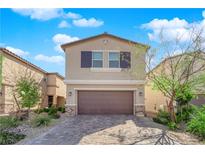 Charming two-story home with a well-manicured lawn and a two-car garage at 9176 Bluebell Knoll Ct, Las Vegas, NV 89178