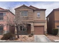 Charming two-story home with a well-maintained yard and inviting curb appeal in a suburban neighborhood at 1820 Peridot Point St, Las Vegas, NV 89106