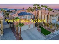 Beautiful two-story home featuring solar panels, a two-car garage, and professionally landscaped yard at 506 Staghorn Pass Ave, Las Vegas, NV 89183