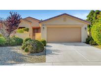 Charming single-story home with a well-maintained front yard and a two-car garage at 5327 Progresso St, Las Vegas, NV 89135