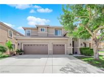 Charming two-story home with a three-car garage and manicured landscaping on a sunny day at 7715 Villa De La Paz Ave, Las Vegas, NV 89131