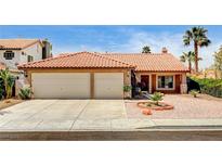 Charming single-story home featuring a well-manicured front yard and a spacious two-car garage at 8851 Quintane Ln, Las Vegas, NV 89123