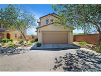 Inviting two-story home with a well-maintained front yard and attached two-car garage at 8853 Autumn Teal Ave, Las Vegas, NV 89178
