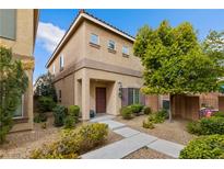 Charming two-story home featuring a landscaped front yard and inviting entrance at 9494 Alma Ridge Ave, Las Vegas, NV 89178