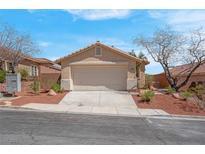 Charming single-story home with a well-maintained front yard and a two-car garage in a suburban neighborhood at 1608 Blooming Rose St, Las Vegas, NV 89144