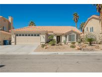 Charming single-story home with a well-manicured xeriscaped front yard and tile roof at 3961 Equinox Ct, Las Vegas, NV 89147